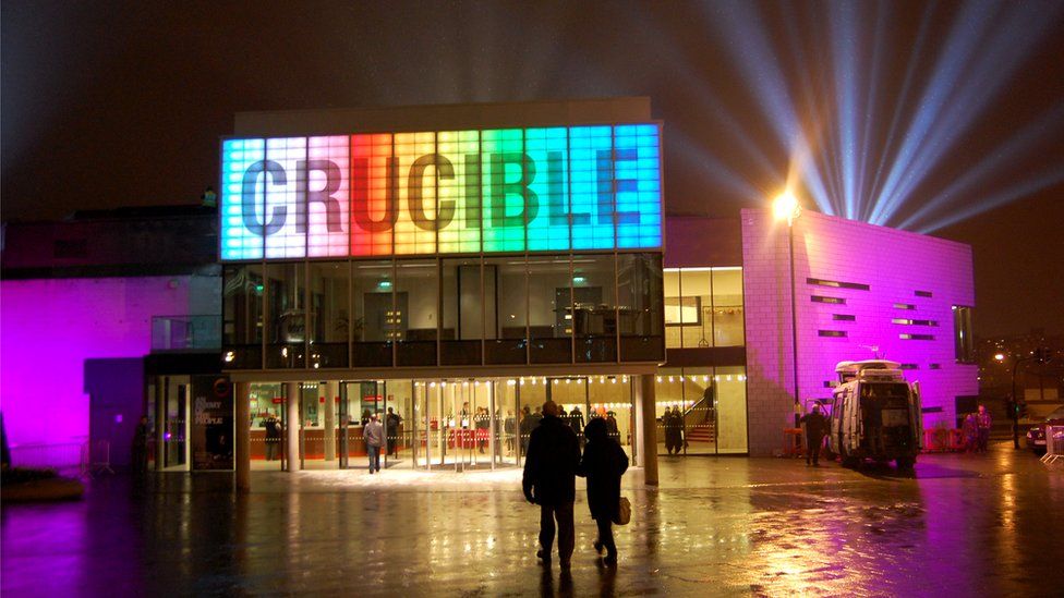 A photo of the Crucible from the outside all lit up